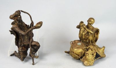 paire de figurines anciennes en bronze représentant un homme et une femme