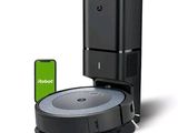 an image of a robotic vacuum cleaner with a phone next to it