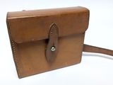 brown leather handbag on white background with brown strap