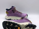 a close up of a pair of purple hiking shoes on a white surface