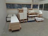 a room with a lot of boxes and pallets