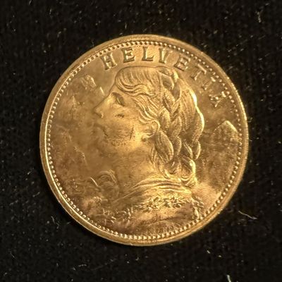 an image of a gold coin with a woman ' s face on it