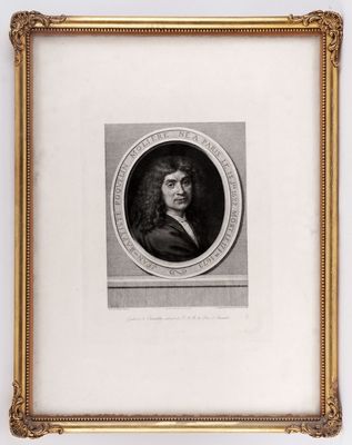 a black and white portrait of a man in a gold frame