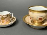 a cup and saucer sitting on a table