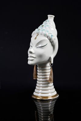 a statue of a woman with a hat on it ' s head