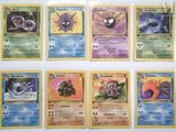 several pokemon cards are lined up in a row on a table