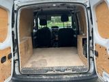 the inside of a van with the doors open