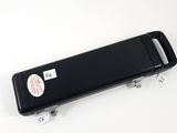 a black case with a sticker on it sitting on a white surface