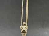 an antique brass candle holder with two candles on top of it
