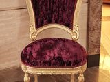 a chair that is sitting in the middle of a room