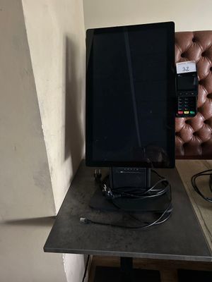 a computer monitor sitting on top of a desk