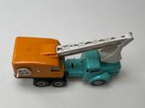 a toy truck with a crane attached to it ' s back