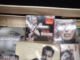 a lot of dvds on a shelf in a room