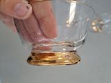 a person that is holding a glass in their hand