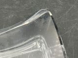 a clear piece of glass sitting on a table