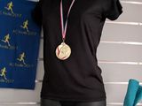 a mannequin with a gold medal on a table