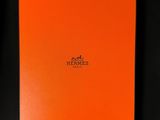 an orange book with the word hermes written on it