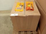 two boxes of food sitting on a pallet in a room