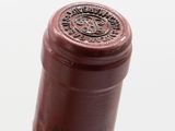 a bottle of wine that is sitting on a table