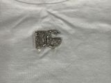 the back of a white shirt with the letter d on it