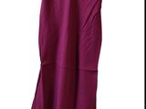 a picture of a purple dress hanging on a wooden hanger