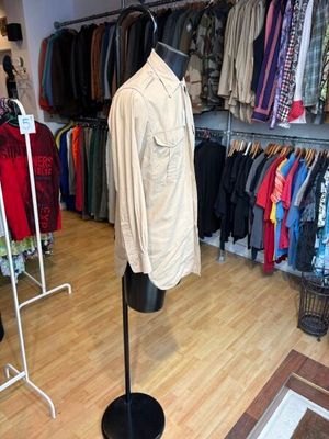 an image of a clothing store with a mannequin in front of it