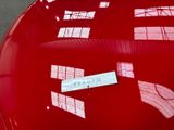 a sticker on the hood of a red car