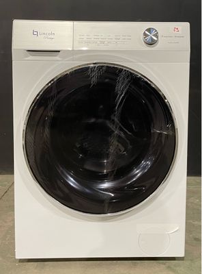 a white washing machine sitting on top of a tiled floor