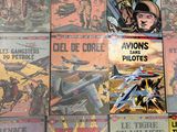 a lot of comic books that are on the table
