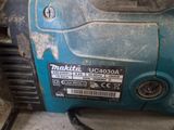 a blue and black machine that is sitting on the floor