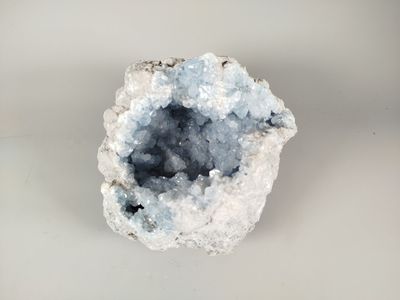an image of a piece of rock with a small piece of ice on it