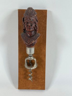 a bottle opener that has a picture of a man on it