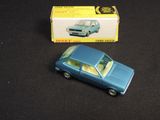 a toy car that is sitting next to a box