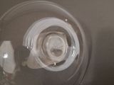 a close up view of a glass bowl with a piece of paper in it