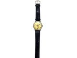 an image of a wrist watch with a yellow dial on a black strap