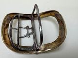 a metal belt buckle with a metal buckle on it