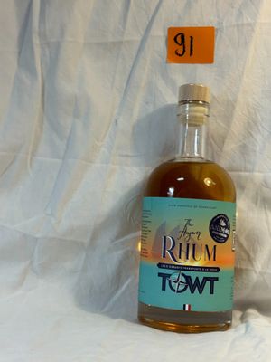 a bottle of rum in front of a white background