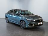 a blue car is parked in a room with a white wall