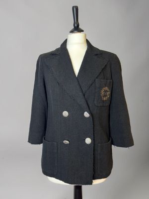 jacket on a mannequin stand with a white background