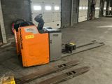 a picture of a forklift sitting in a warehouse