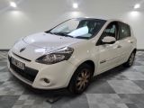 a picture of a small white car parked in a garage