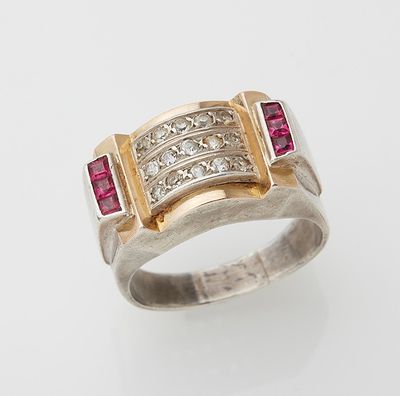 an 18k gold and diamond ring with rubies