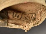 a close up of a baseball glove with a mouse inside of it