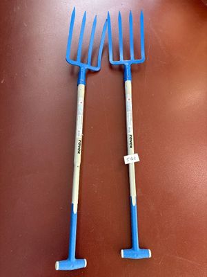 two forks that are sitting on a table