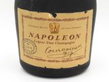 a bottle of wine that is sitting on a table