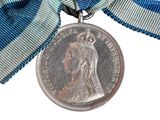 a medal with a ribbon around it and a medal on it