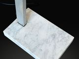 an image of a white marble floor lamp on a black background