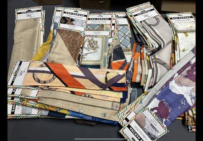 a lot of different types of ties on a table
