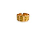 a close up of a gold ring on a white background