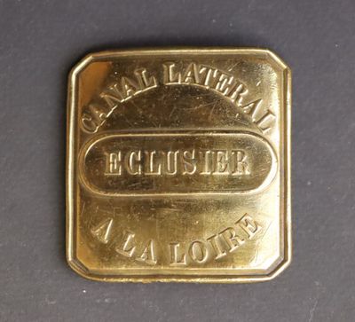 a close up of a gold bar on a black surface